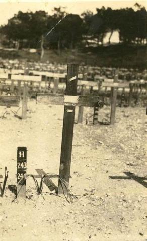 Grave shown as a single wooden post.