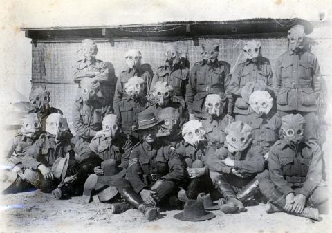 Black and white photo of soldiers in gas masks, featuring Thomas Kennedy Irwin Jr