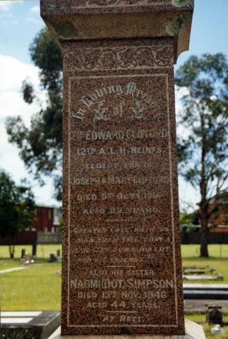Brown headstone of Edward Clifford's grave.