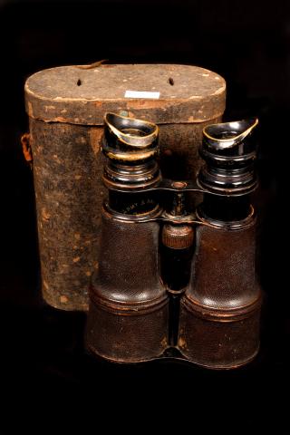 Picture of field glasses with its case.