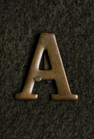 Image depicts a picture of the Anzac badge. 