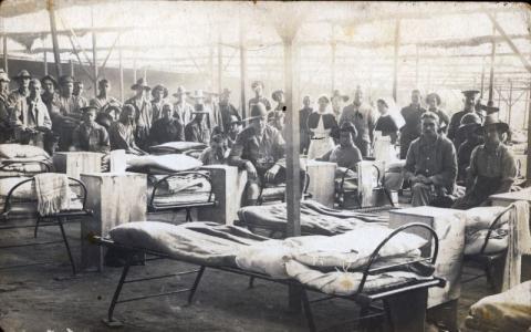 Black and white photo of soldiers in a hospital ward.