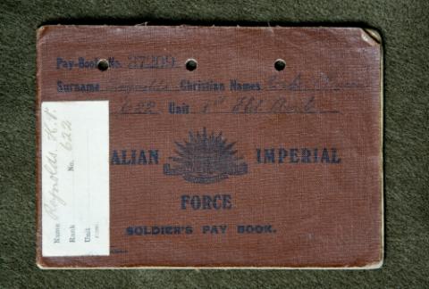 Image depicts leather-bound brown pay book. 