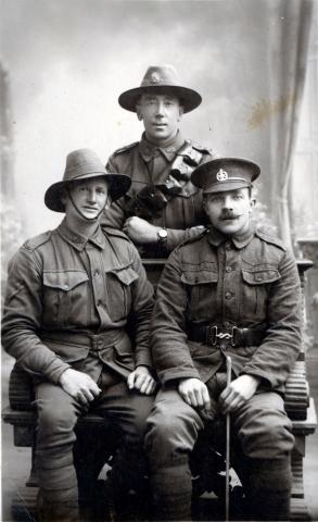 Black and white portrait of three soldiers in uniform