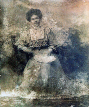 Faded worn black and white photograph of Annie Combellack