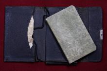 Picture of the diary in a fabric case.