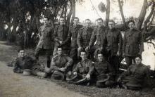 Black and white photo of Thomas Irwin and friends in uniform