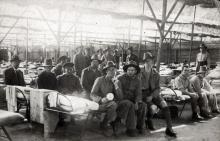 Black and white photo of soldiers in a hospital ward.
