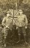 Sepia photo of Arthur Smith and friend posing in front of the Union Jack