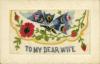 Postcard with embroidered flowers. Inscription reads: To My Dear Wife