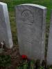 Headstone of Roy O'Neill with singular red poppy